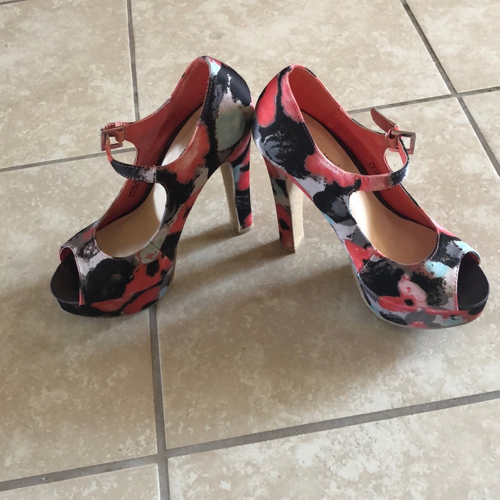 A pair of colorful high heeled pumps
